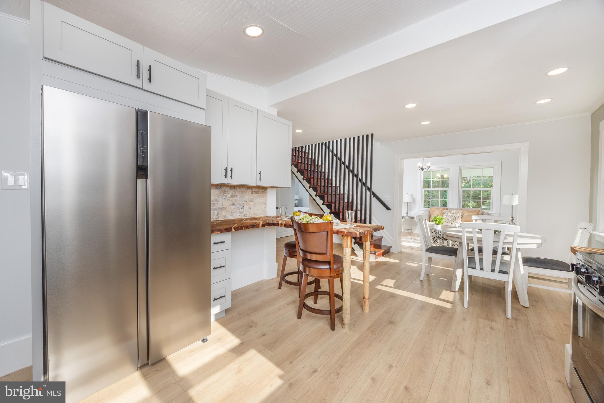 107 Rock Ridge Road Ottsville, PA 18942 - Photo 6 of 24 a view of a kitchen with dining table and chairs