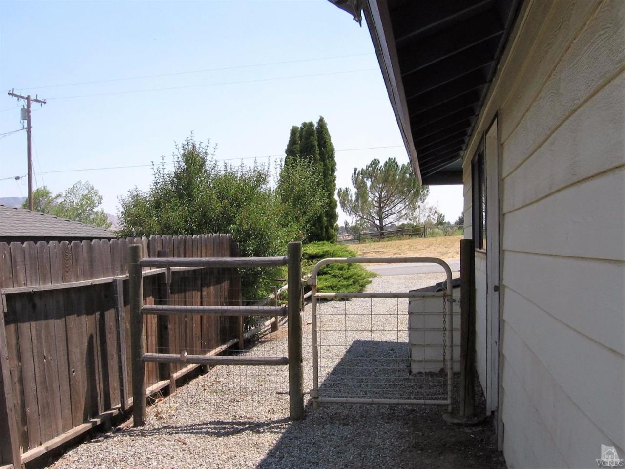 22813 Clover Spring Place Tehachapi, CA 93561 - Photo 18 of 20 a view of a balcony with wooden floor and fence