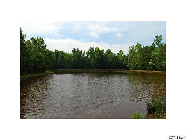 2318 Shiloh Unity Road Lancaster, SC 29720 - Photo 1 of 12 a black and white photo of a lake
