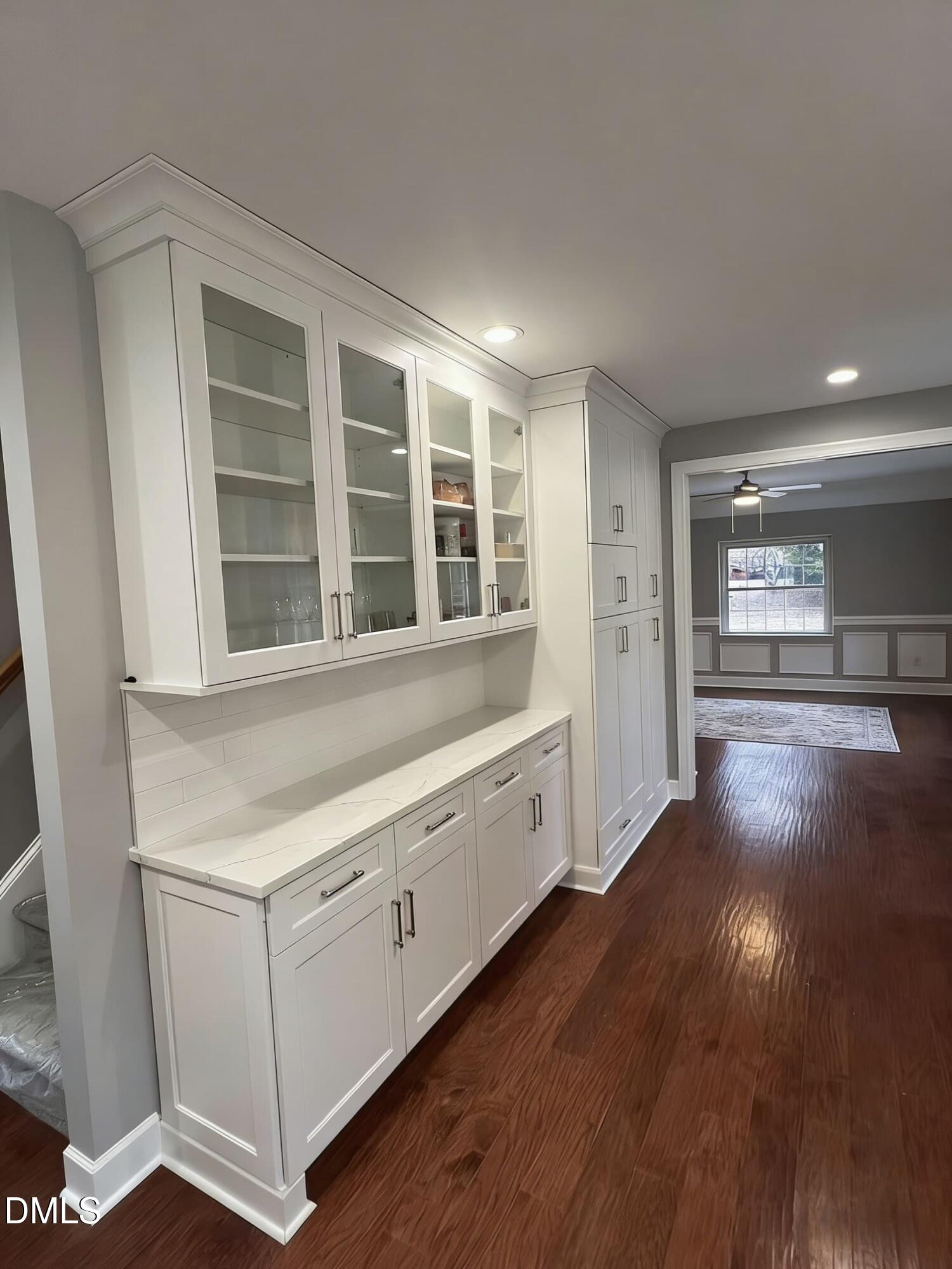 409 Rockingham Street Carthage, NC 28327 - Photo 11 of 56 a view of an empty room with a window and wooden floor