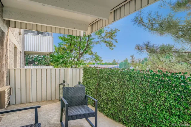 a view of balcony with furniture