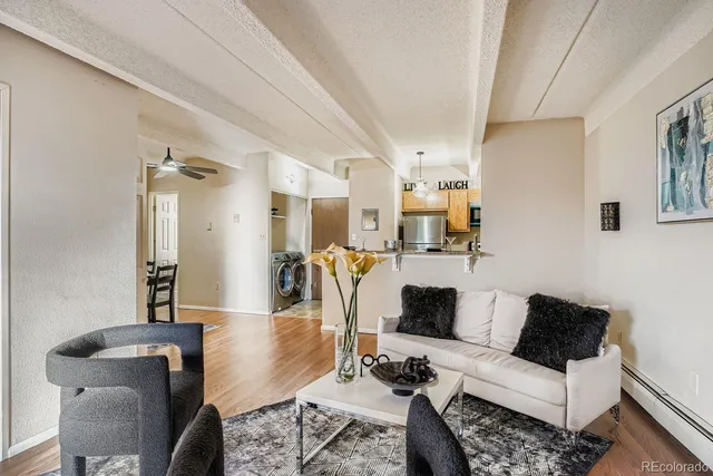 a living room with furniture and a table