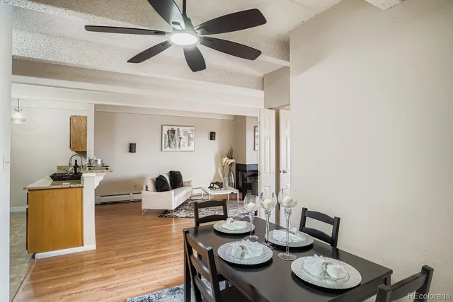 a view of a dining room with furniture and wooden floor