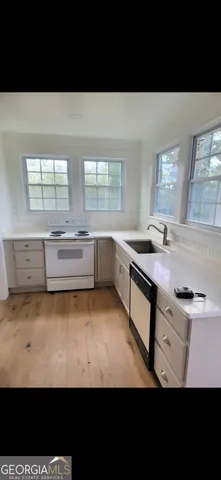 a kitchen with a sink and cabinets