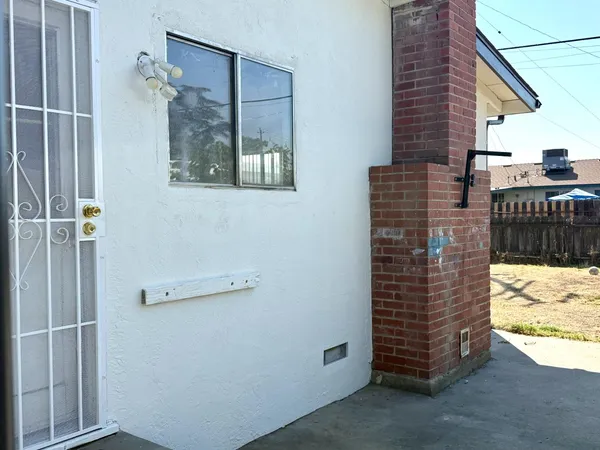 a bathroom with a shower and a sink