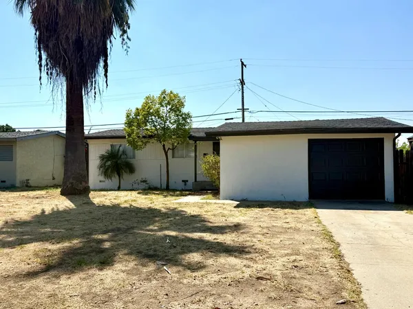 a front view of a house with a garage