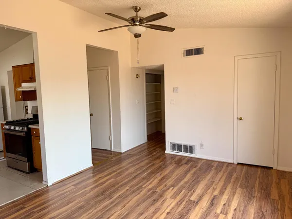 a view of a livingroom with wooden floor