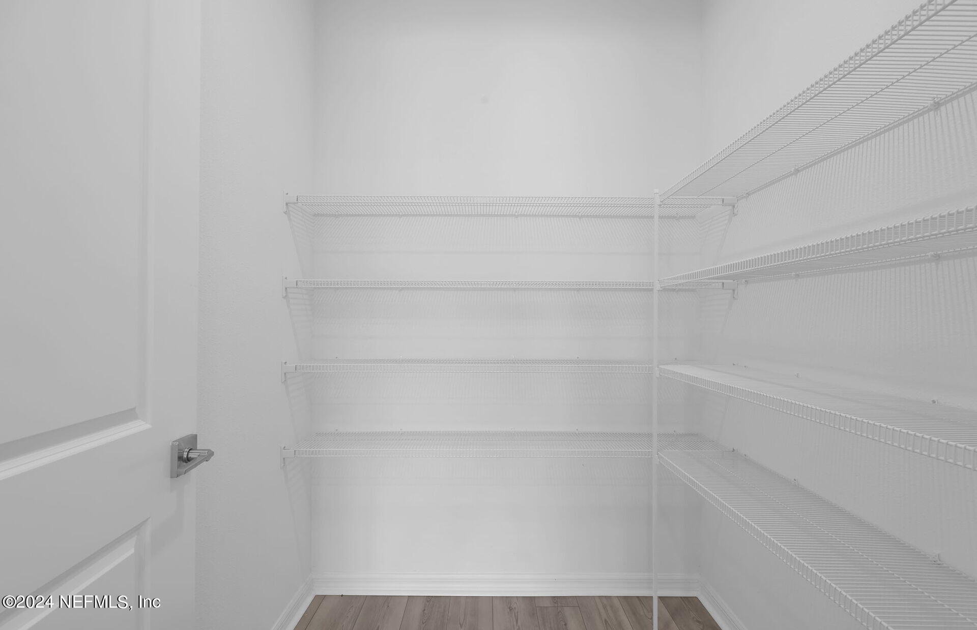 236 Hickory Pine Drive St. Augustine, FL 32092 - Photo 12 of 46 a view of a room with empty racks