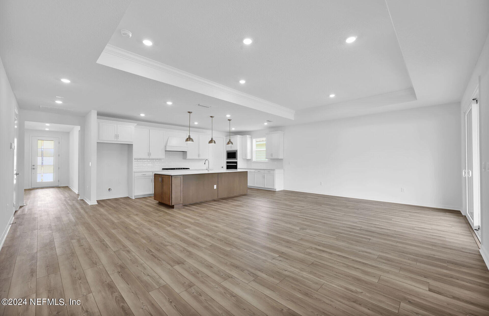 236 Hickory Pine Drive St. Augustine, FL 32092 - Photo 14 of 46 a view of kitchen with kitchen island wooden floor center island and stainless steel appliances