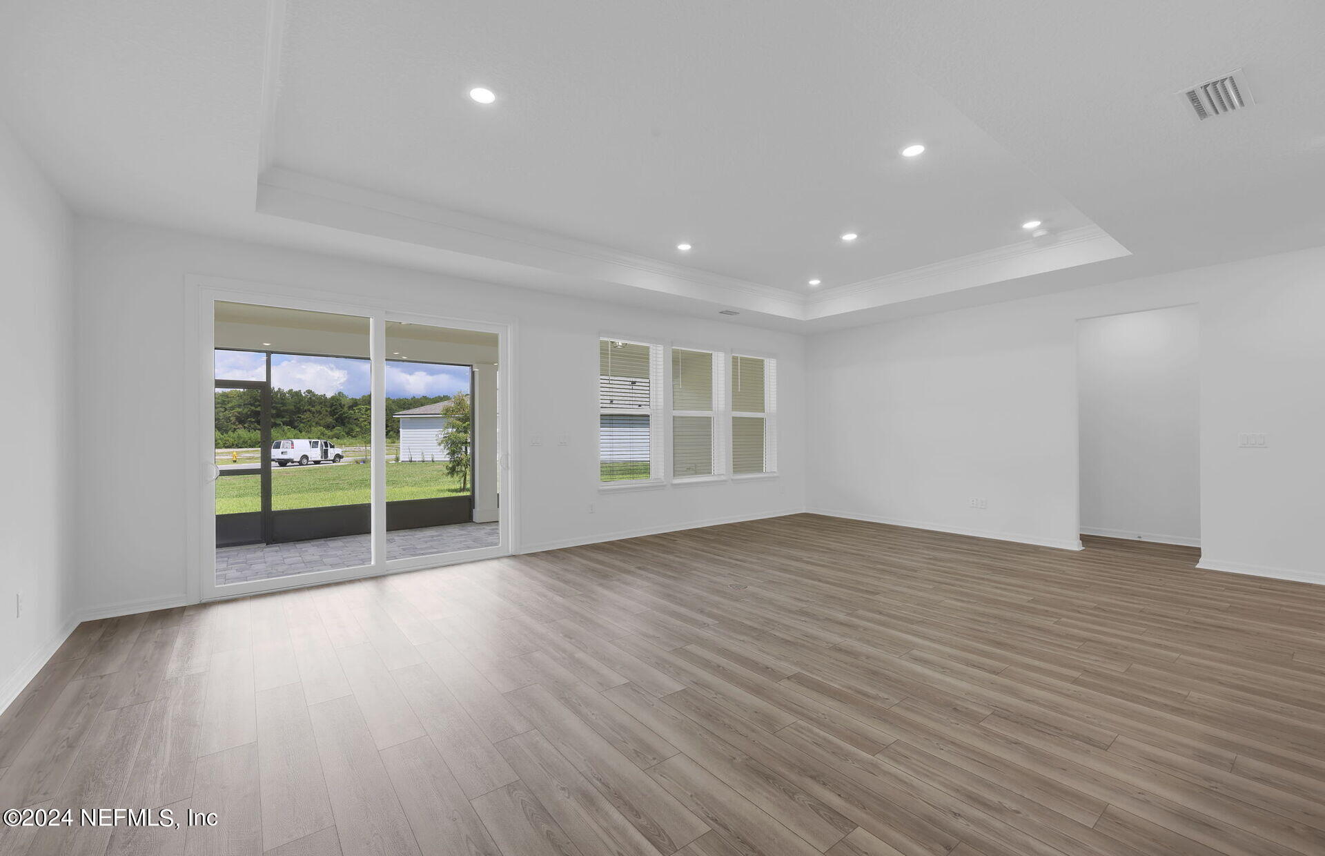 236 Hickory Pine Drive St. Augustine, FL 32092 - Photo 18 of 46 a view of an empty room with wooden floor and a window