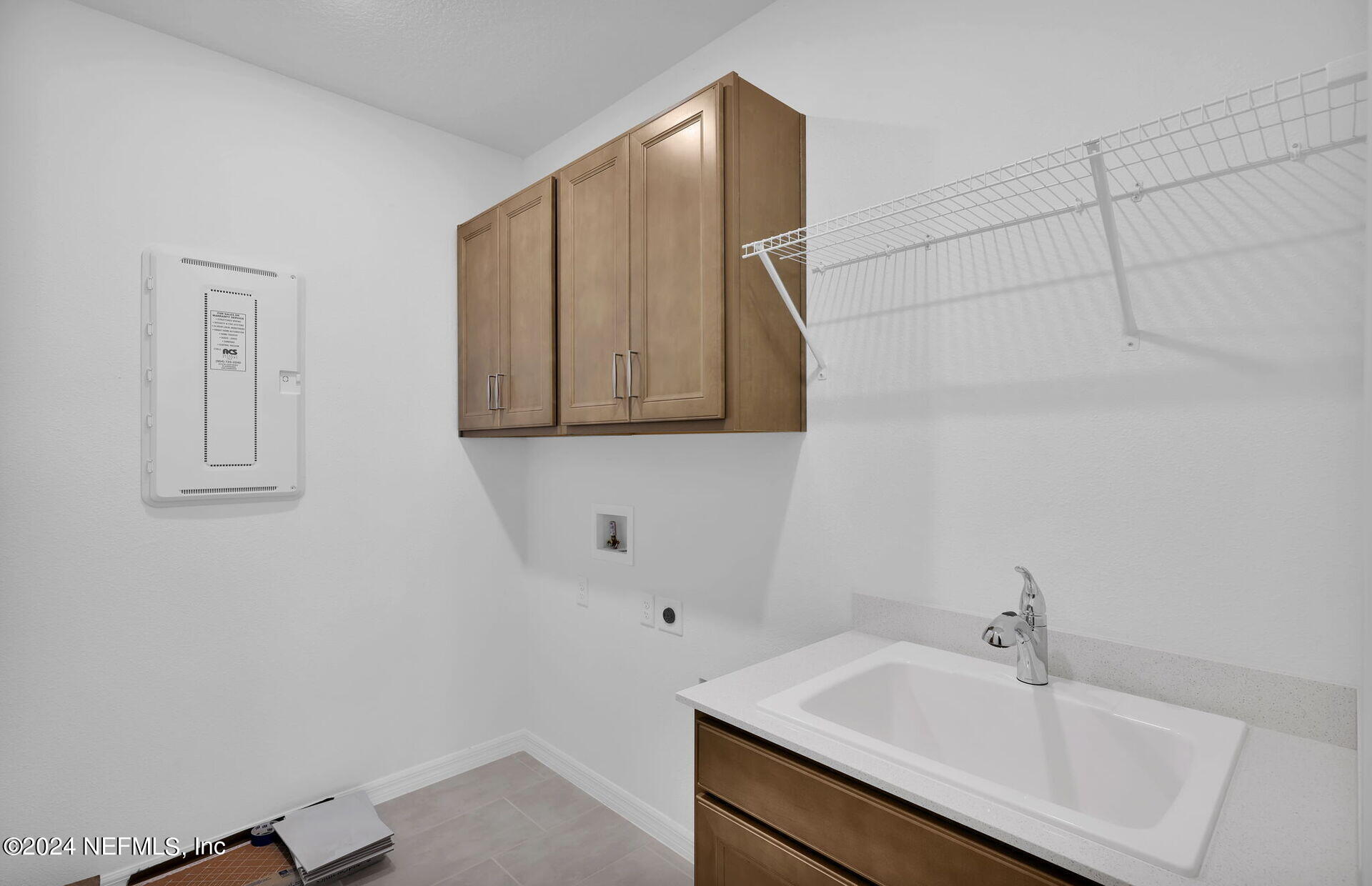 236 Hickory Pine Drive St. Augustine, FL 32092 - Photo 27 of 46 a bathroom with a sink and a mirror
