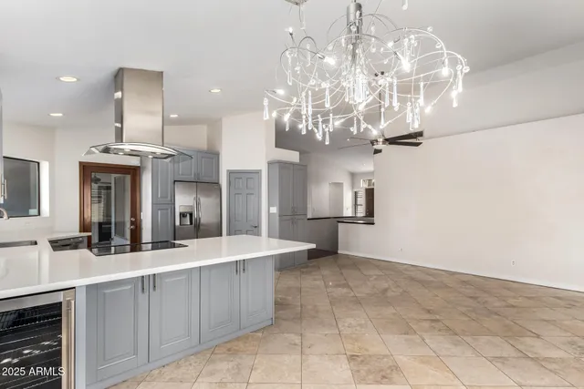 a large bathroom with a sink a large mirror and vanity