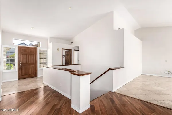 a view of kitchen with sink and refrigerator