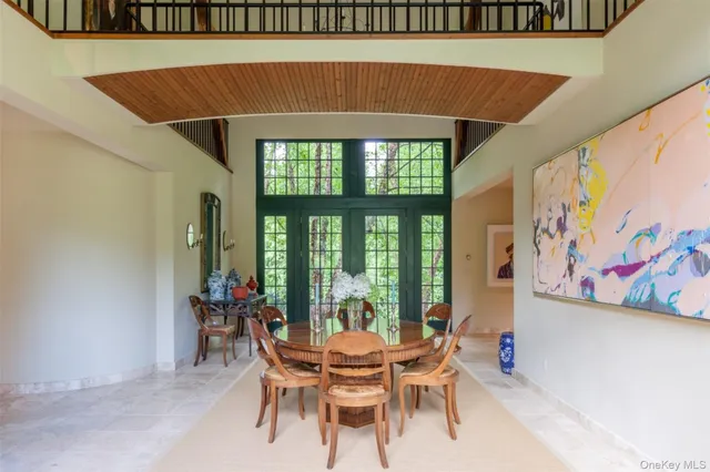 a front view of a house with outdoor seating