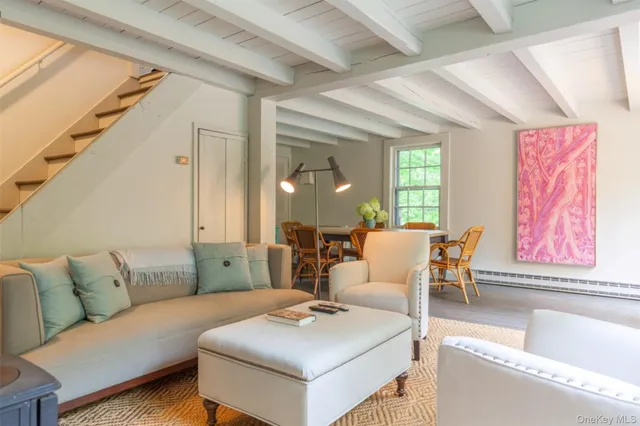 a bedroom with a bed and a chair