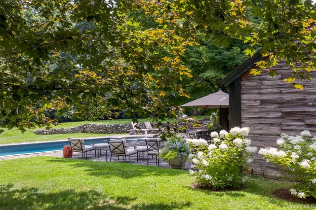 a view of a chair and table of the garden
