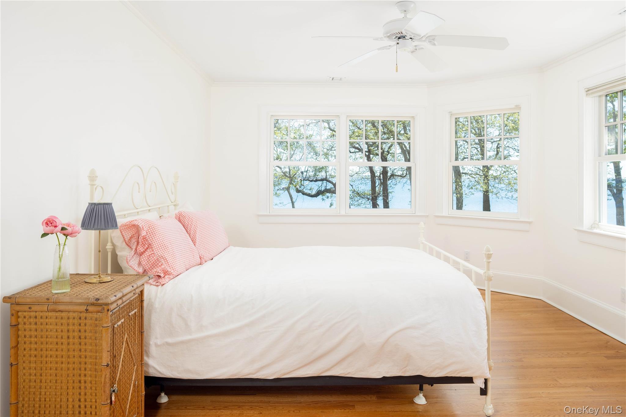 5055 New Suffolk Road New Suffolk, NY 11956 - Photo 26 of 42 a bedroom with a bed and window