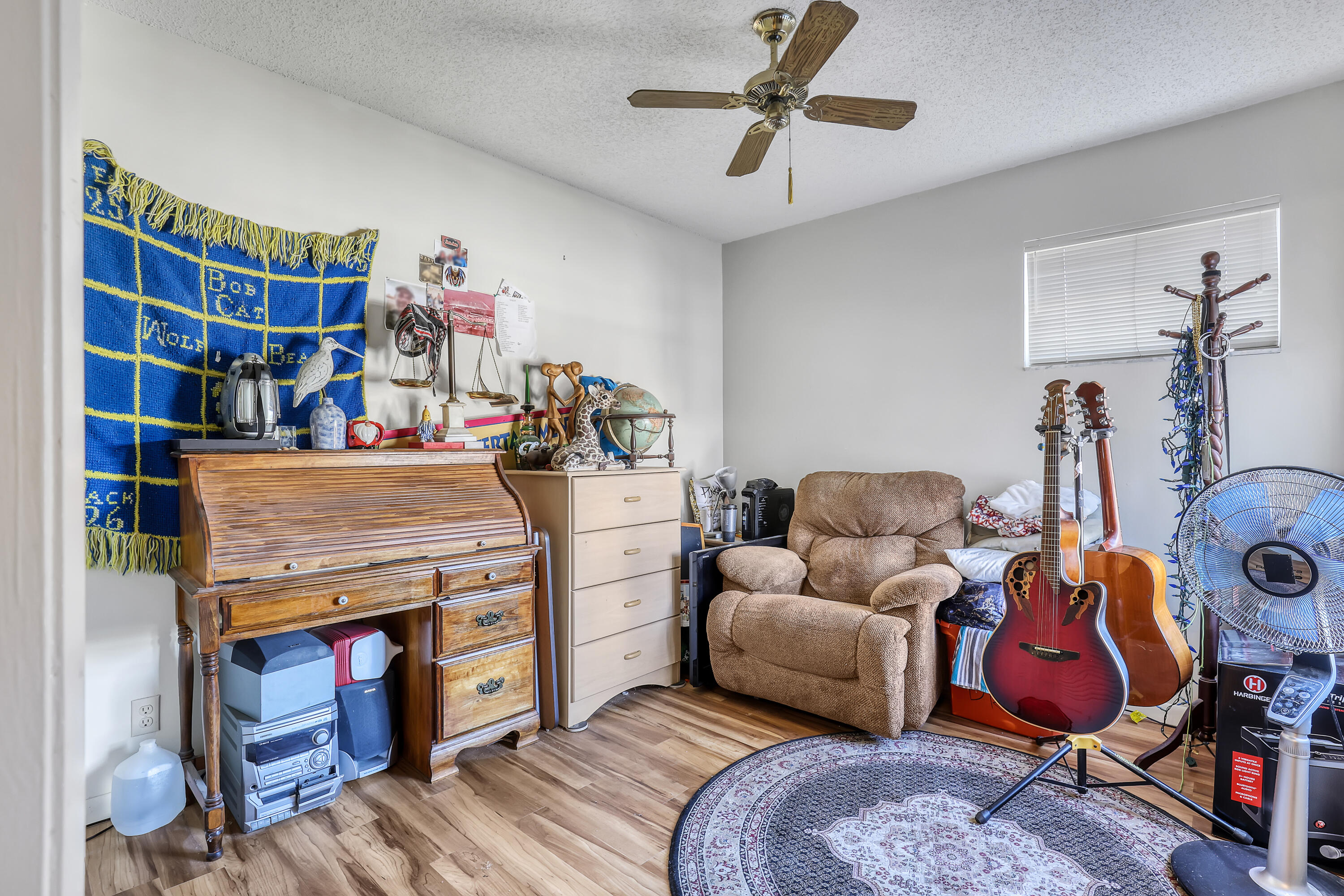 13116 Quiet Woods Road, Unit A Wellington, FL 33414 - Photo 26 of 31 a bedroom with furniture and a book shelf