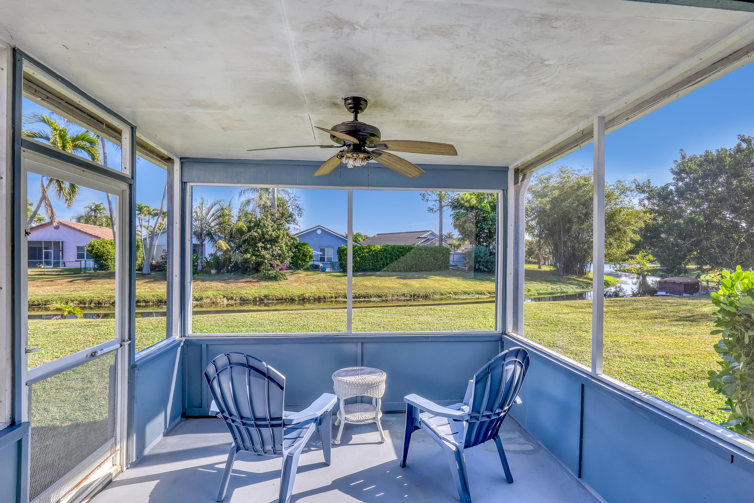 13116 Quiet Woods Road, Unit A Wellington, FL 33414 - Photo 27 of 31 a view of a dining room with furniture window and outside view
