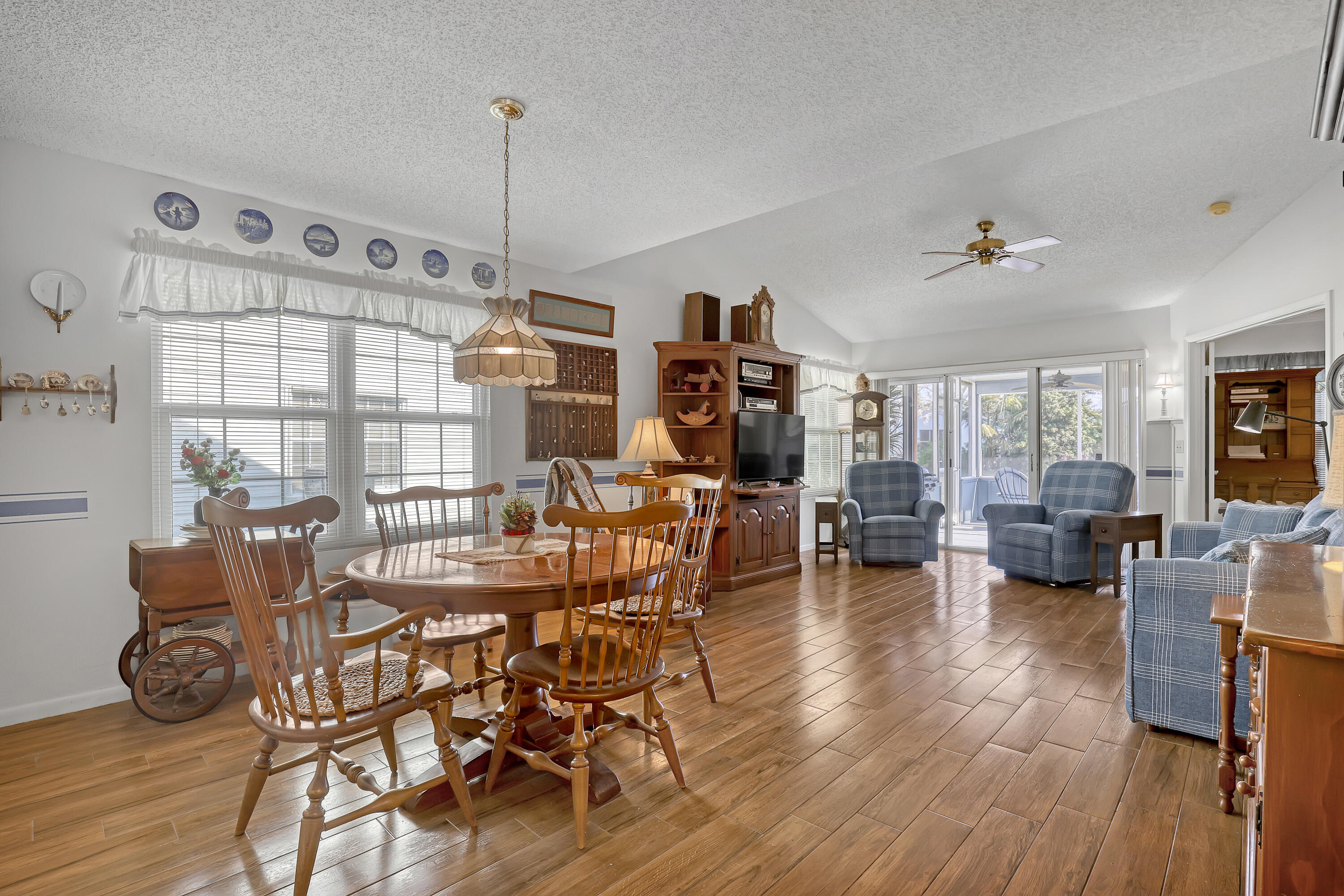13116 Quiet Woods Road, Unit A Wellington, FL 33414 - Photo 5 of 31 a view of a dining room with furniture window and wooden floor