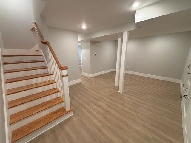 a view of entryway with wooden floor