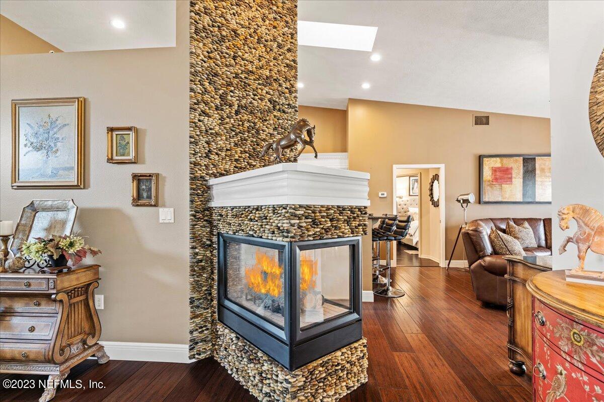 1289 North Cherry Pop Drive Hernando, FL 34442 - Photo 16 of 99 a living room with furniture a fireplace and a flat screen tv