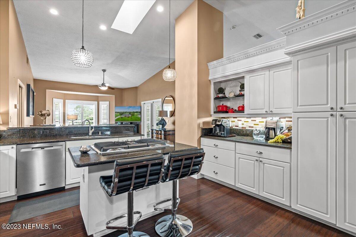 1289 North Cherry Pop Drive Hernando, FL 34442 - Photo 20 of 99 a kitchen that has a lot of cabinets in it and stainless steel appliances