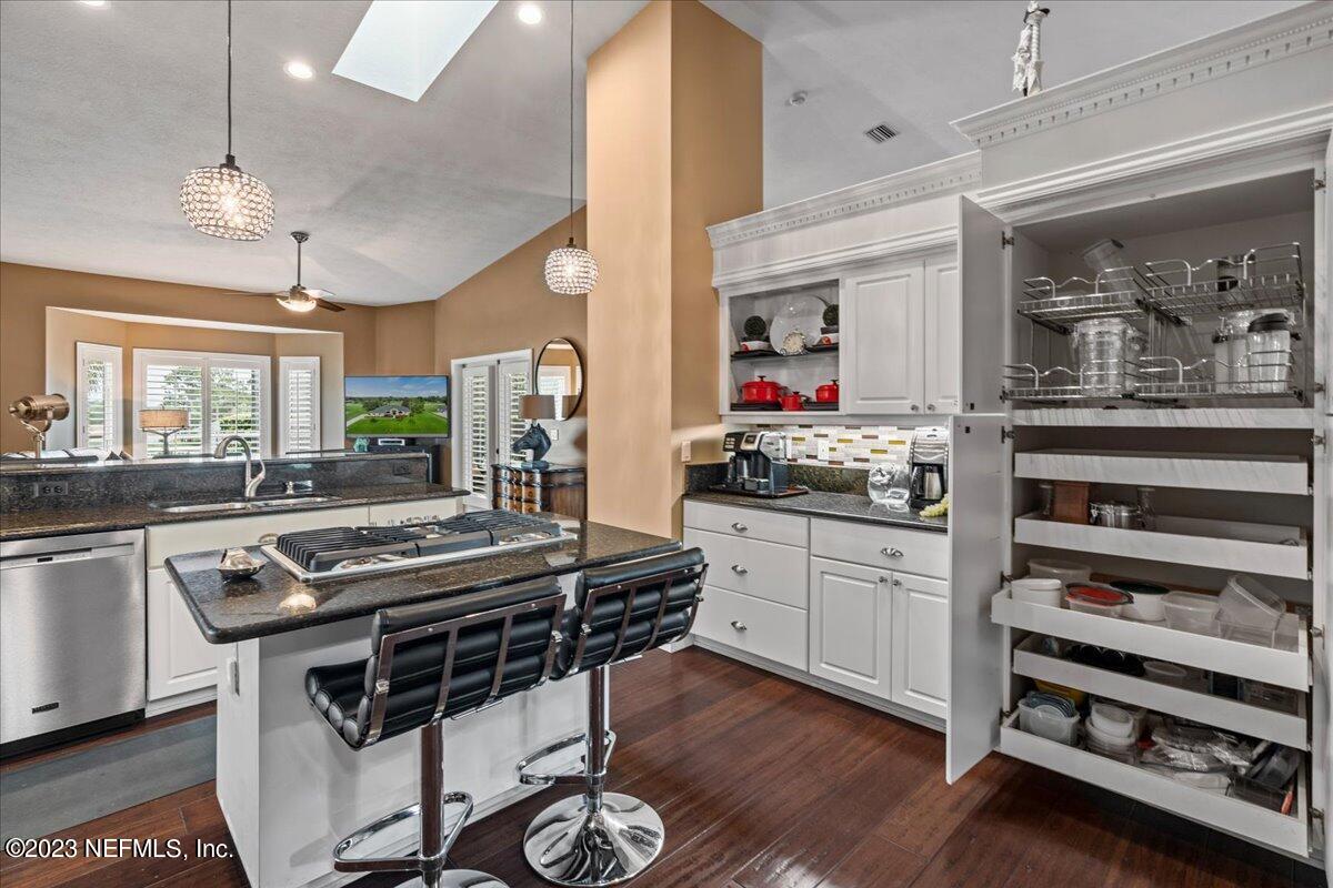 1289 North Cherry Pop Drive Hernando, FL 34442 - Photo 23 of 99 a kitchen with stainless steel appliances a stove a sink cabinets and wooden floor