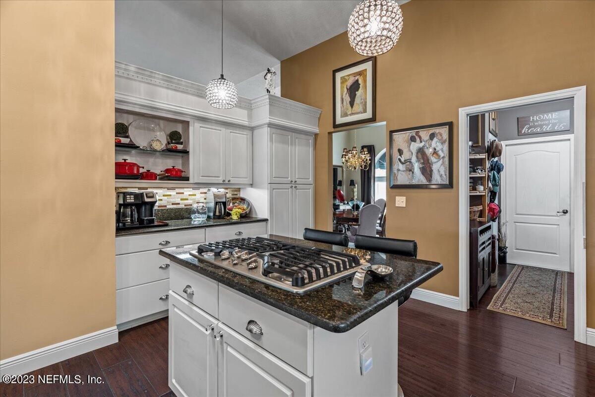 1289 North Cherry Pop Drive Hernando, FL 34442 - Photo 29 of 99 a kitchen with stainless steel appliances granite countertop a stove and a refrigerator
