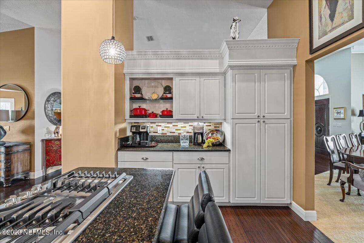 1289 North Cherry Pop Drive Hernando, FL 34442 - Photo 30 of 99 a kitchen with stainless steel appliances granite countertop a stove and cabinets