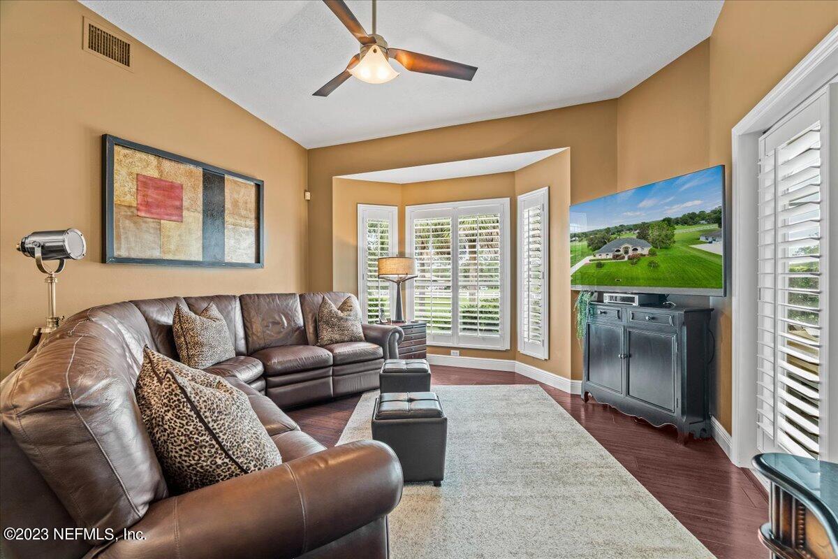 1289 North Cherry Pop Drive Hernando, FL 34442 - Photo 36 of 99 a living room with furniture and a window