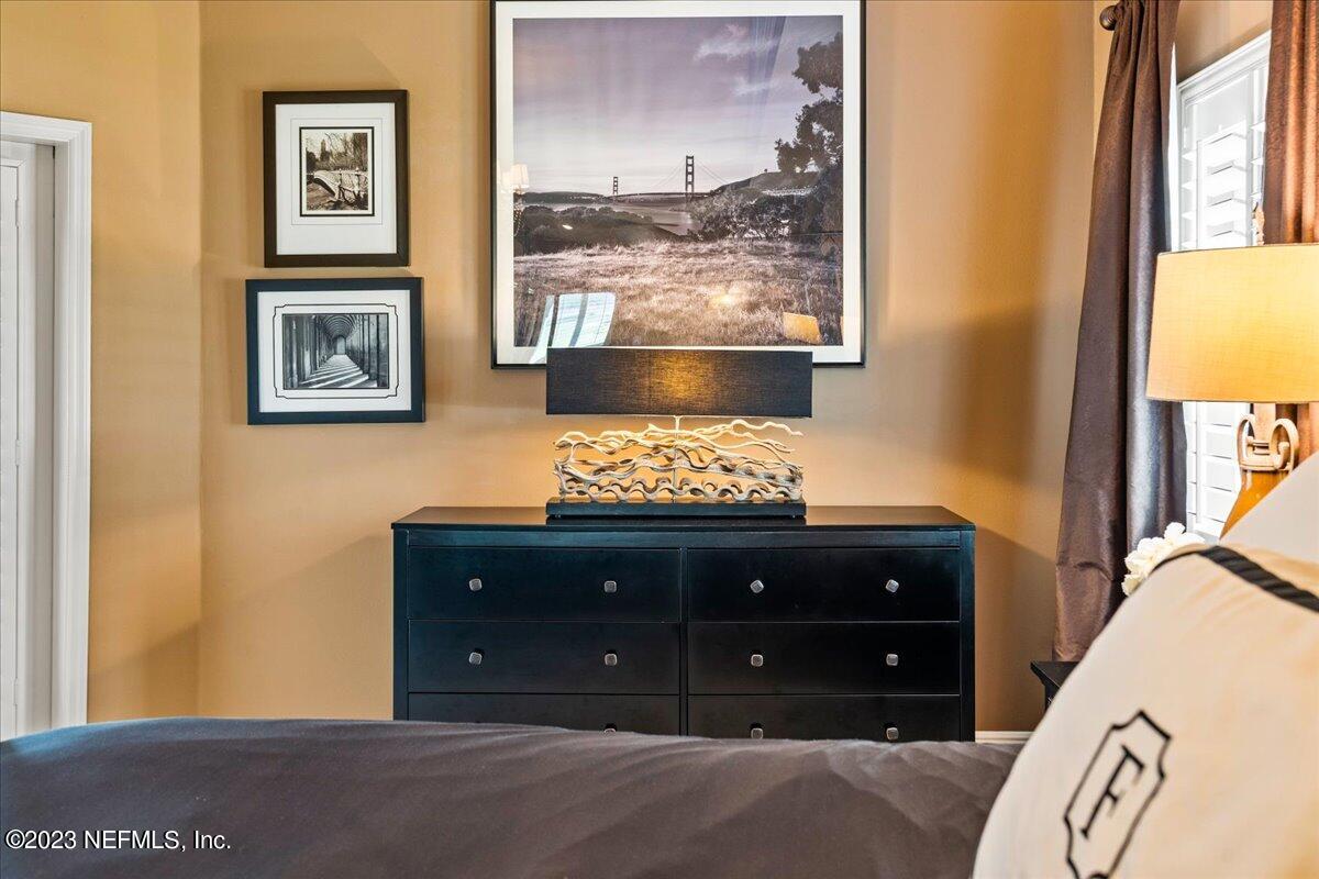 1289 North Cherry Pop Drive Hernando, FL 34442 - Photo 41 of 99 a room with a bed and a painting on the wall