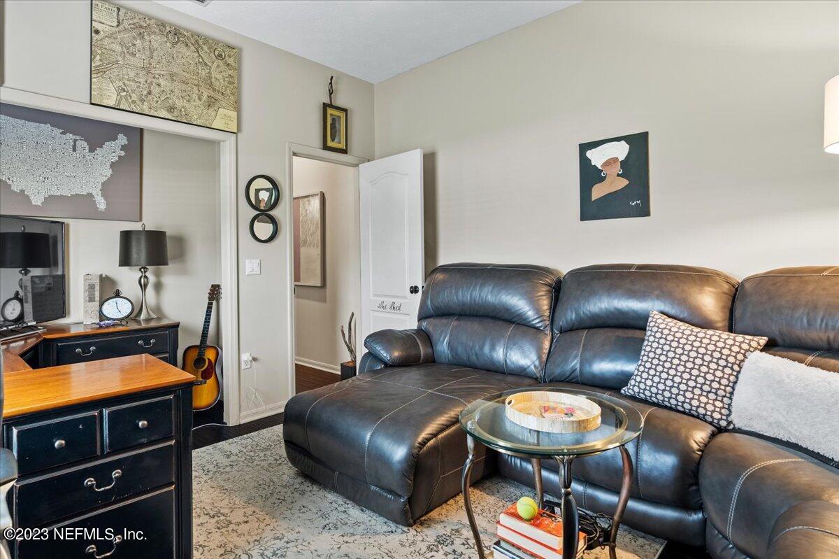 1289 North Cherry Pop Drive Hernando, FL 34442 - Photo 52 of 99 a living room with furniture and a flat screen tv