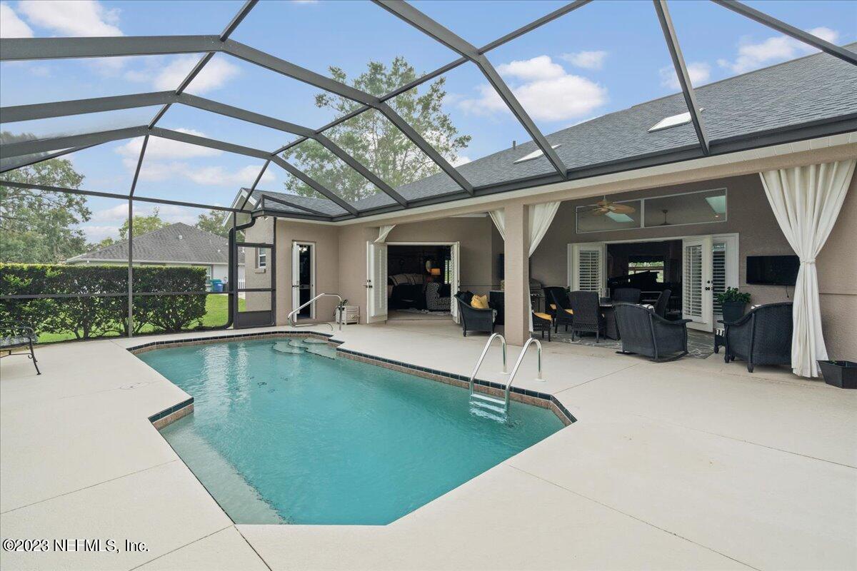 1289 North Cherry Pop Drive Hernando, FL 34442 - Photo 66 of 99 a view of a backyard with a tub and wooden floors