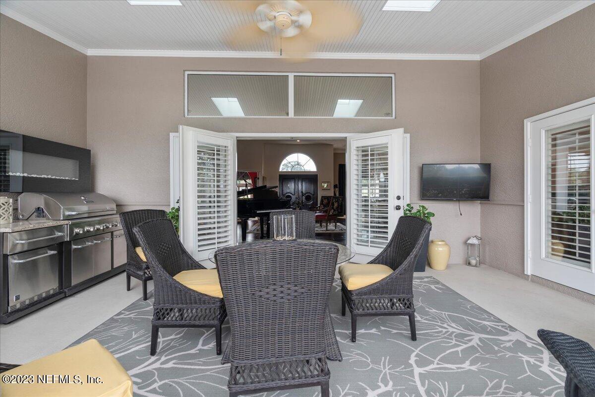 1289 North Cherry Pop Drive Hernando, FL 34442 - Photo 67 of 99 a view of a livingroom with furniture and a flat screen tv