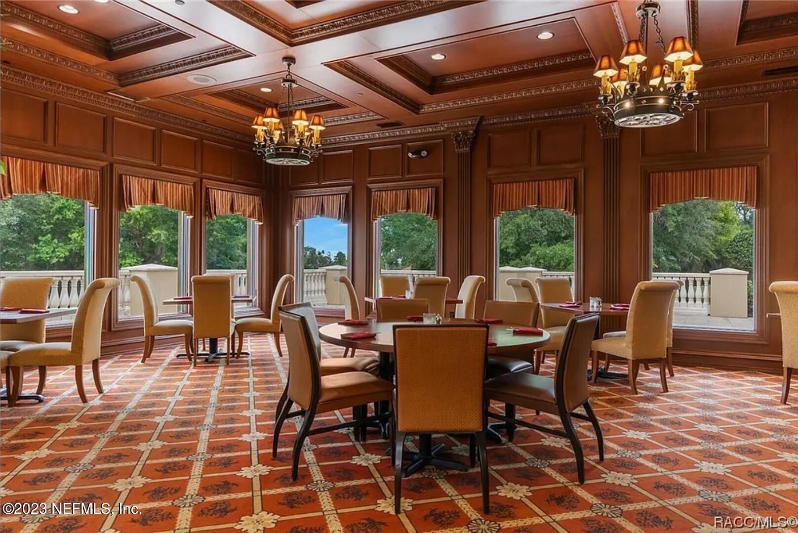 1289 North Cherry Pop Drive Hernando, FL 34442 - Photo 83 of 99 a view of a dining room with furniture wooden floor and chandelier