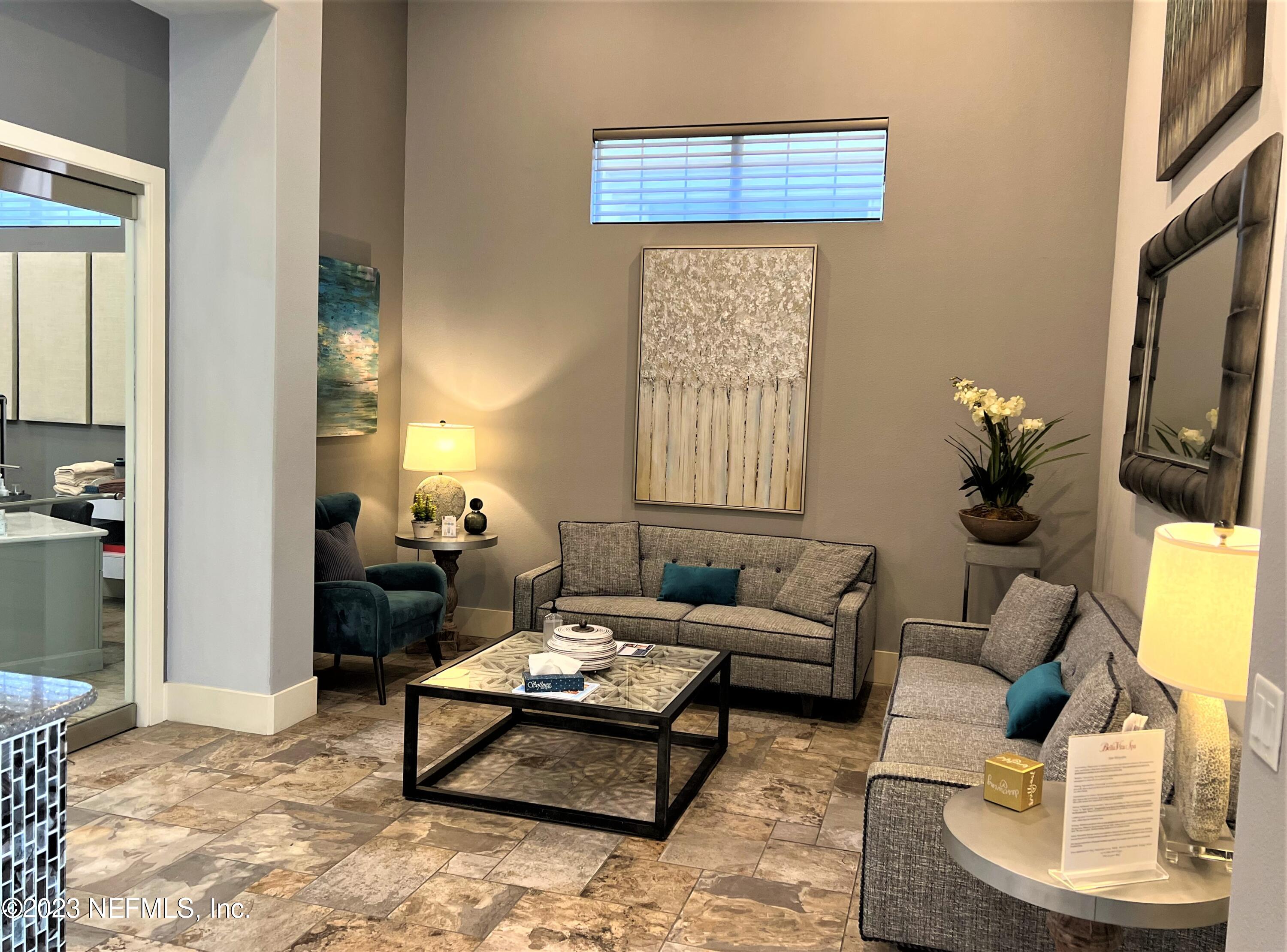 1289 North Cherry Pop Drive Hernando, FL 34442 - Photo 93 of 99 a living room with furniture a lamp and a potted plant