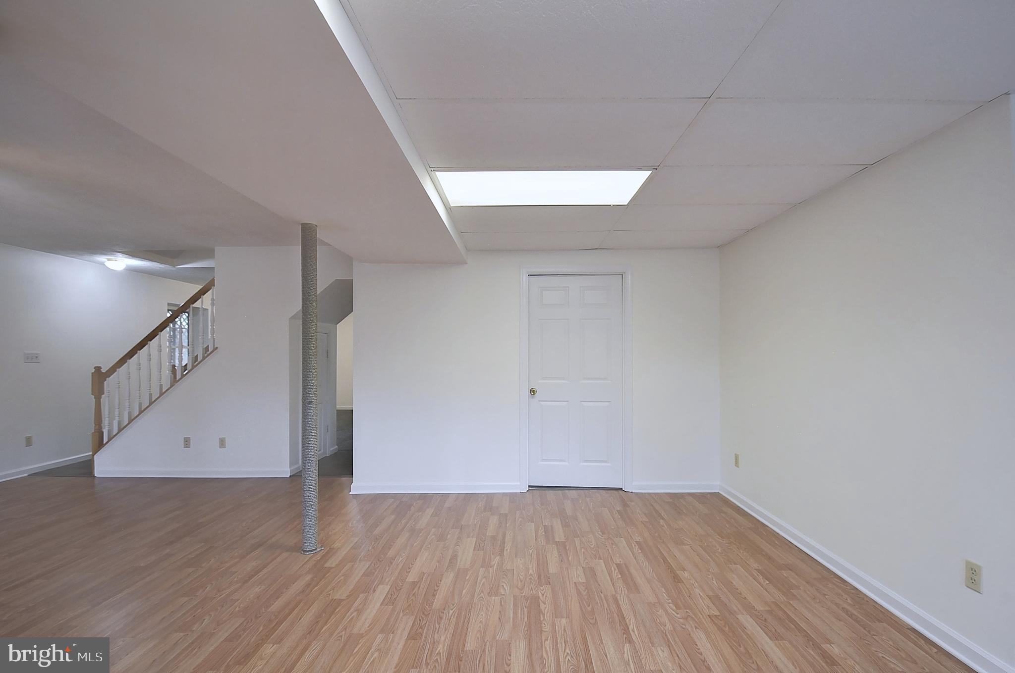 235 Peppermint Spring Lane Winchester, VA 22603 - Photo 23 of 90 a view of an empty room with wooden floor