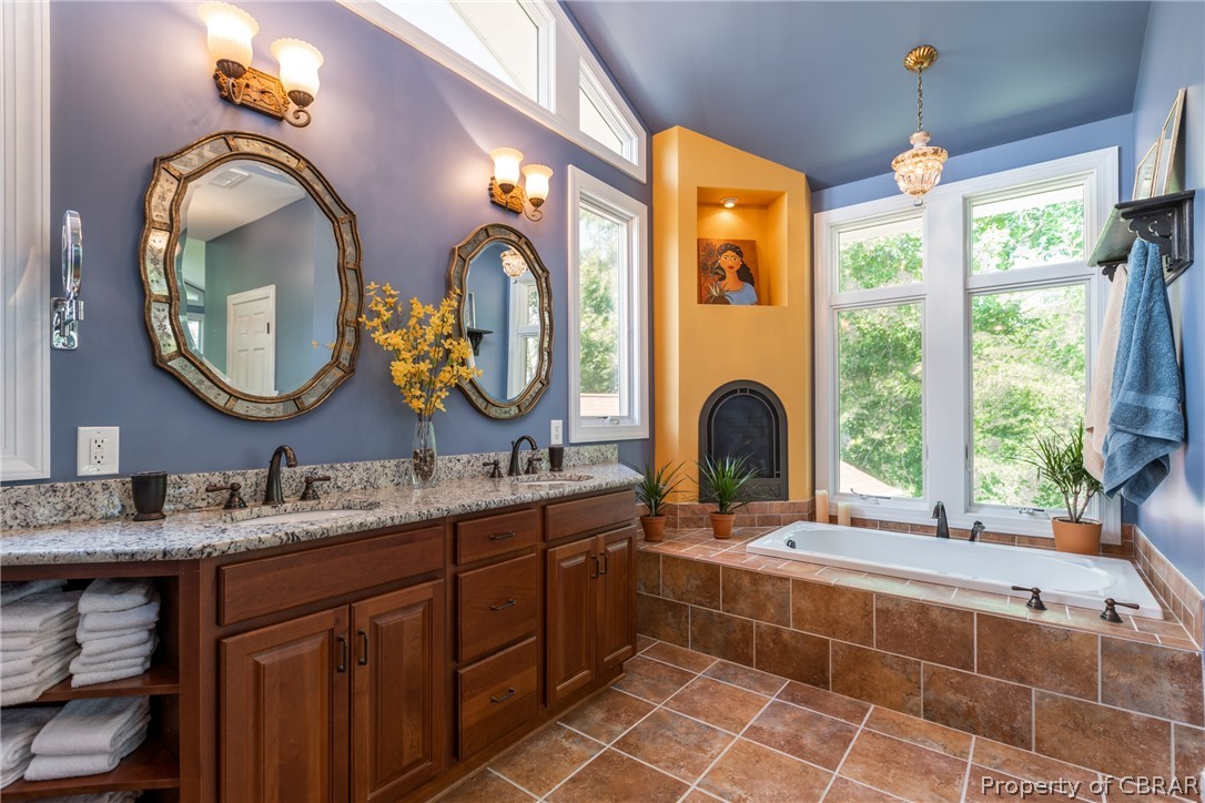 901 Oak Hill Road Lancaster, VA 22503 - Photo 37 of 49 a bathroom with a double vanity sink and a mirror