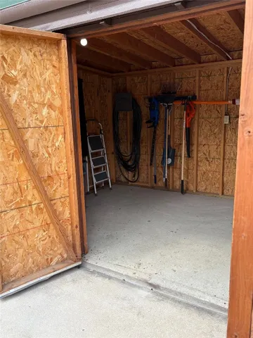 a view of a room with wooden walls