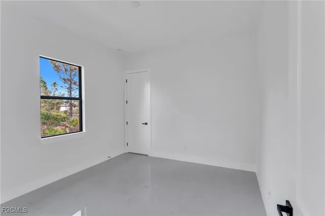a view of an empty room and window