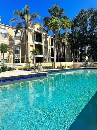 a view of a swimming pool with an outdoor seating