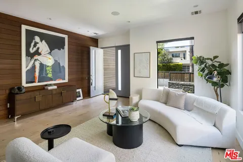 a kitchen with kitchen island granite countertop a table and chairs in it