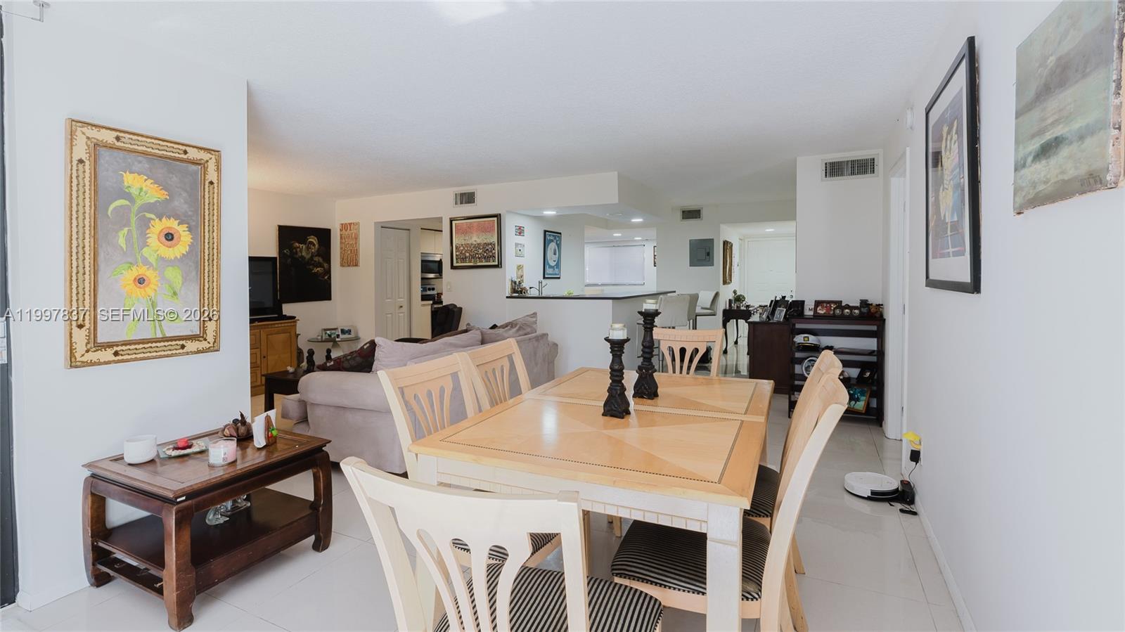 101 Southwest 96th Terrace, Unit 101 Plantation, FL 33324 - Photo 16 of 37 a dining room with furniture and window