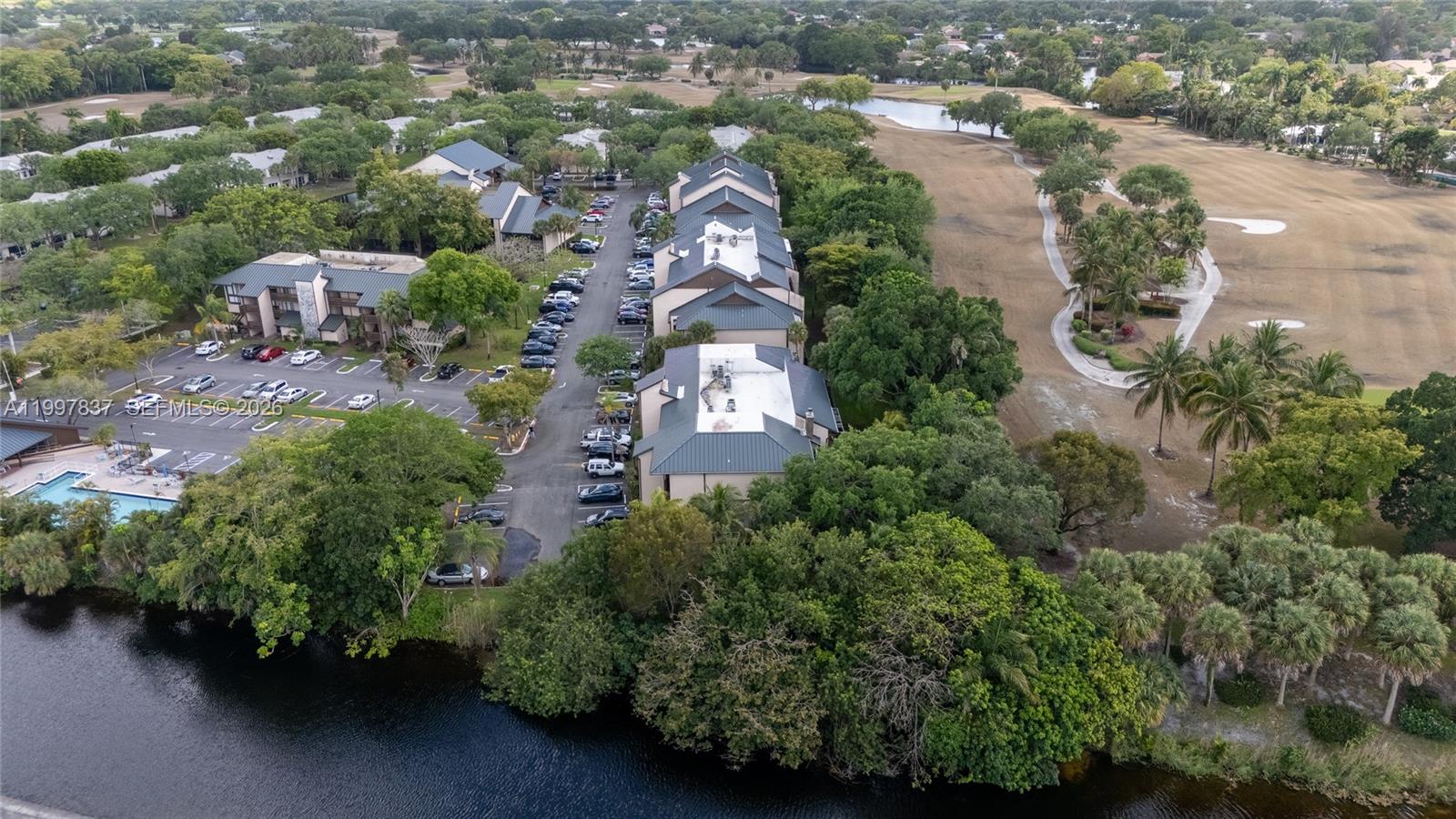 101 Southwest 96th Terrace, Unit 101 Plantation, FL 33324 - Photo 32 of 37 an aerial view of a house with a yard and lake view