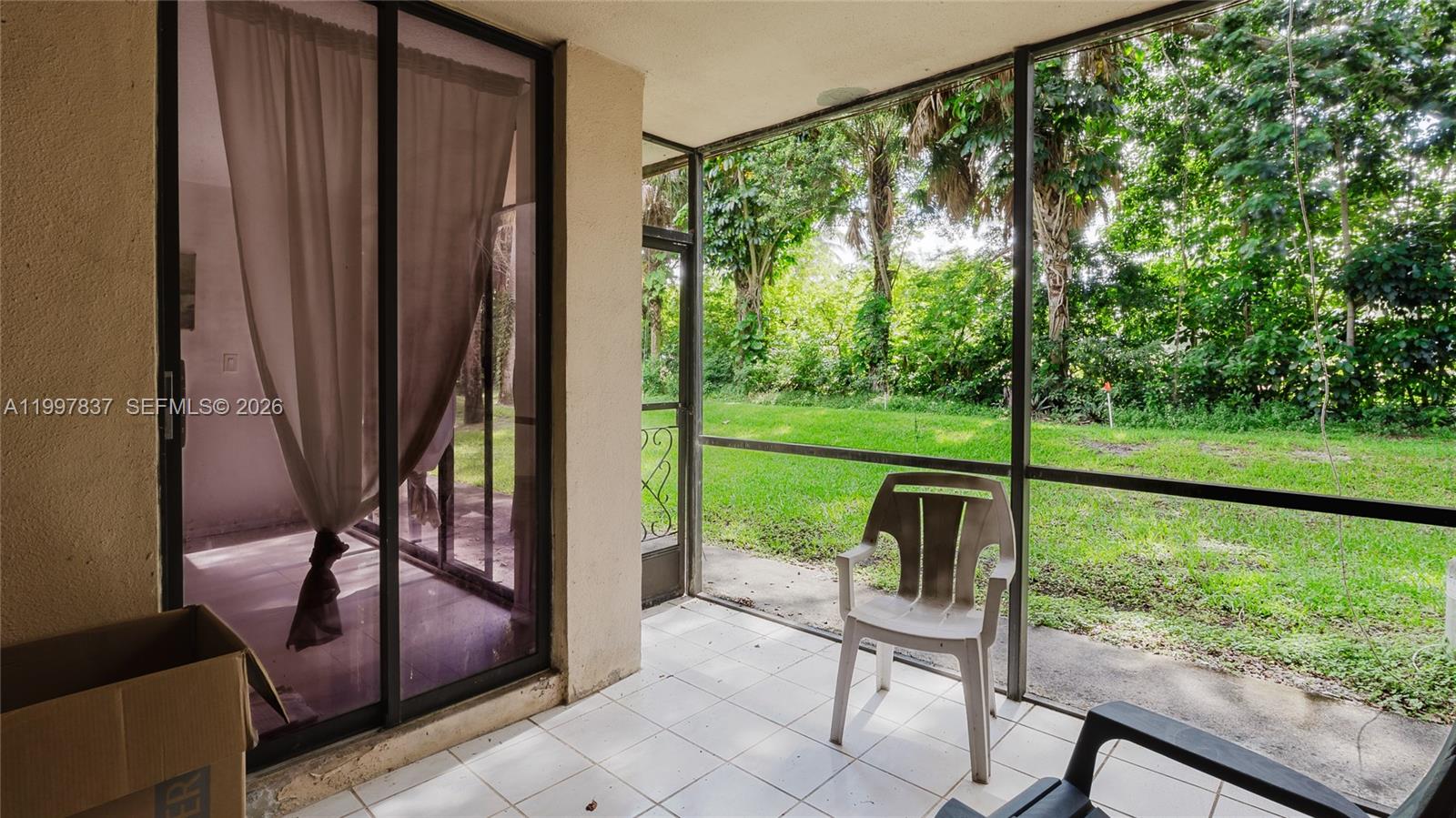 101 Southwest 96th Terrace, Unit 101 Plantation, FL 33324 - Photo 36 of 37 a view of a porch with furniture and garden