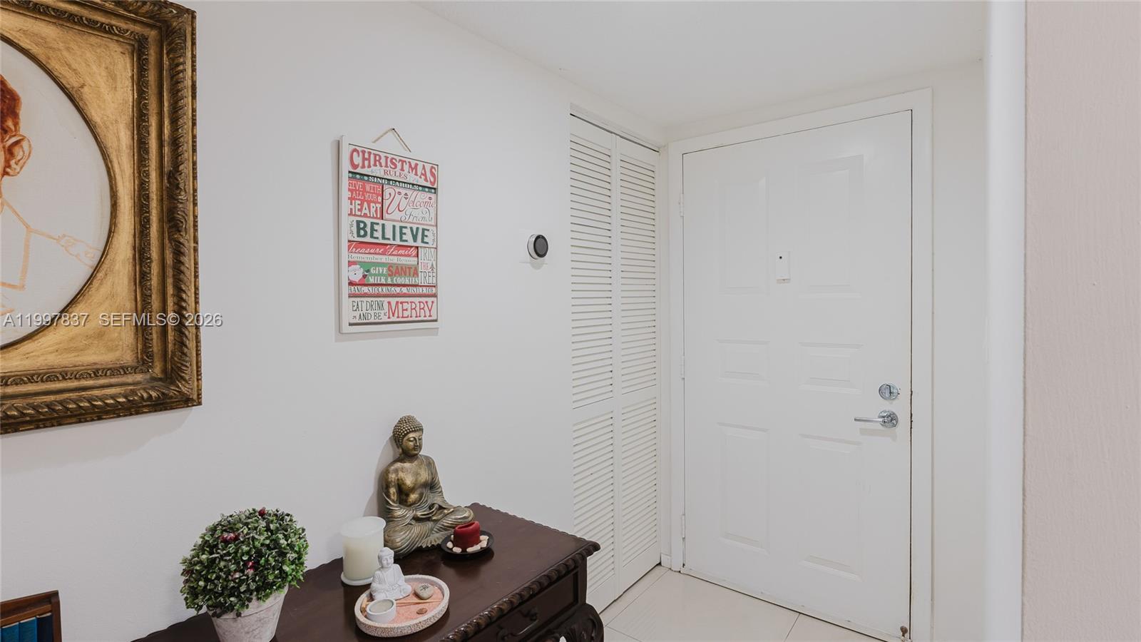 101 Southwest 96th Terrace, Unit 101 Plantation, FL 33324 - Photo 5 of 37 a room with a table and a mirror