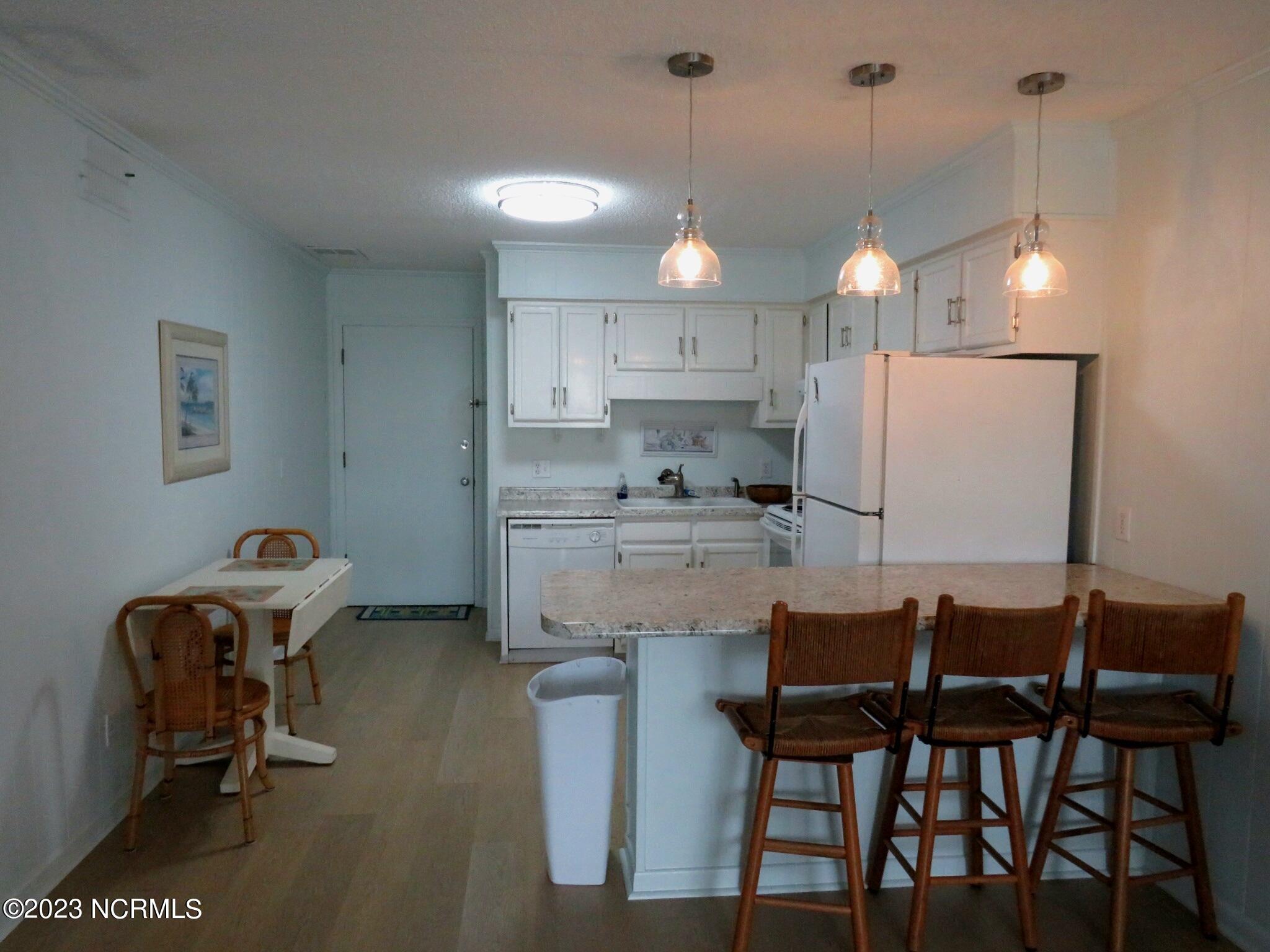 301 Commerce Way, Unit 104 Atlantic Beach, NC 28512 - Photo 8 of 33 Full kitchen/ Dining view