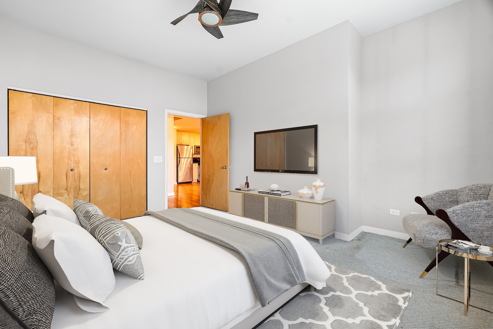 1910 South State Street, Unit 305 Chicago, IL 60616 - Photo 14 of 20 a bedroom with a bed and a flat screen tv