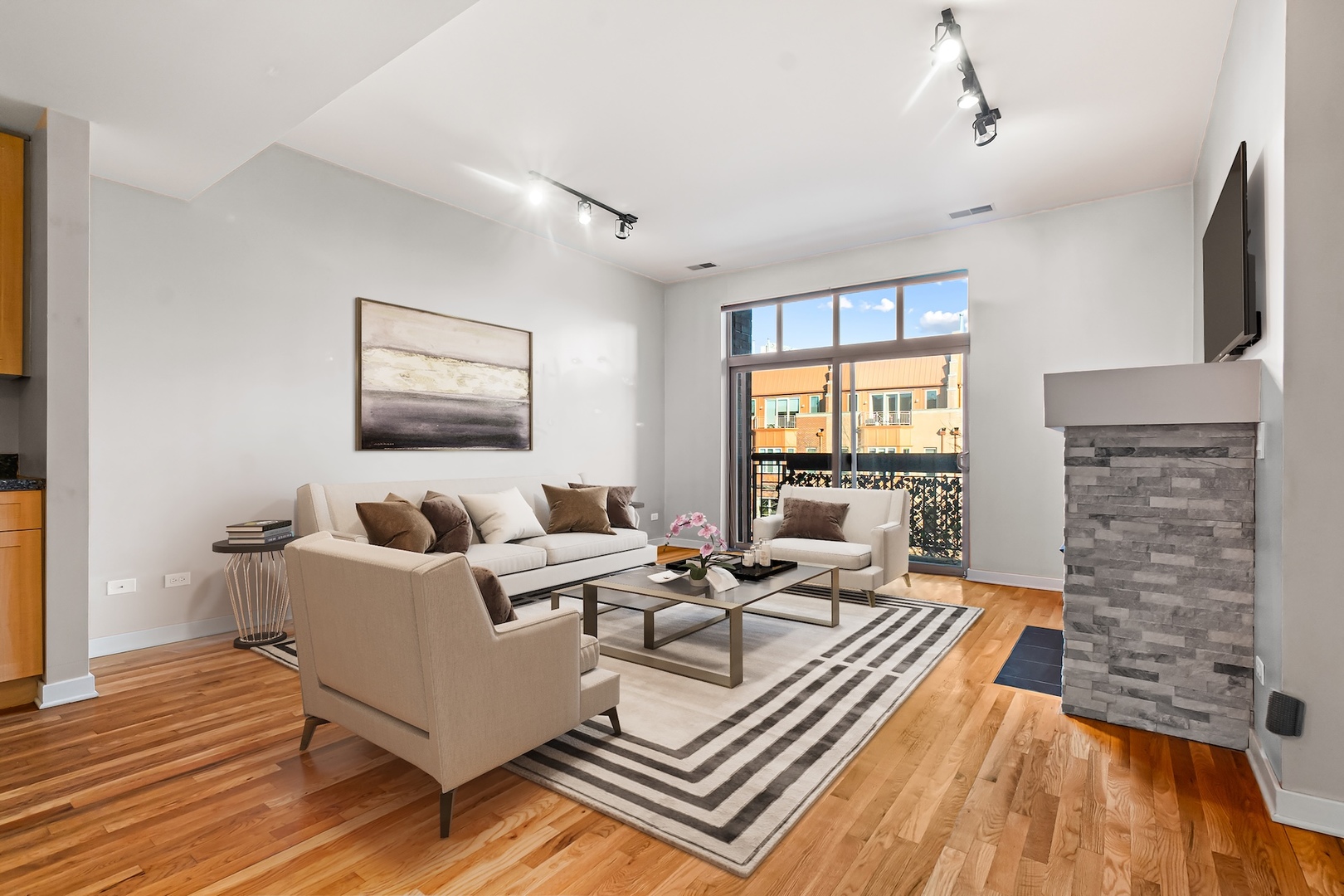 1910 South State Street, Unit 305 Chicago, IL 60616 - Photo 5 of 20 a living room with furniture and a fireplace